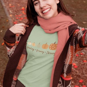 Soft pumpkin-themed mental health shirt, ideal for trauma recovery or fall self-expression, perfect gift for Thanksgiving or classroom wear.
