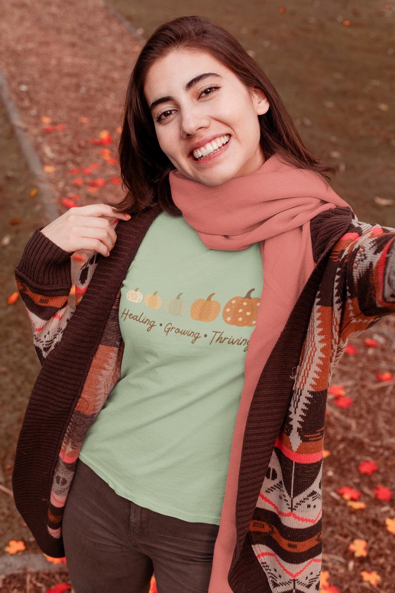 Soft pumpkin-themed mental health shirt, ideal for trauma recovery or fall self-expression, perfect gift for Thanksgiving or classroom wear.