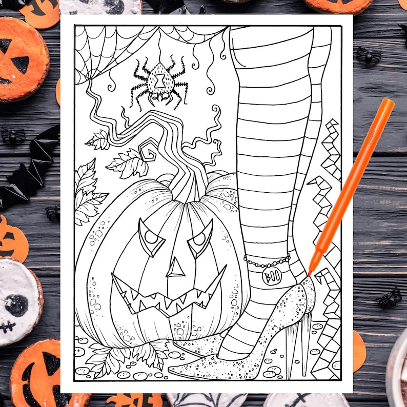 May include: A black and white coloring page featuring a witch's leg with striped stockings and a sparkly shoe, a jack-o'-lantern pumpkin, and a spider web with a spider.