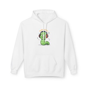 May include: White hoodie featuring a cartoon green worm wearing headphones with the text "EARWORM". The worm is smiling with musical notes around it. The hoodie has a front pocket and a drawstring hood.