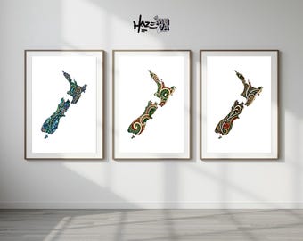 May include: Three framed art prints featuring the map of New Zealand. Each map is filled with intricate, colorful patterns in shades of blue, green, and red. The prints are displayed on a white wall, adding a touch of art to the space.