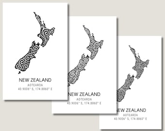 May include: Three white art prints featuring a black, stylized map of New Zealand with intricate swirl patterns. Each print includes the text "NEW ZEALAND AOTEAROA 40.9006° S, 174.8860° E" in a simple, modern font.