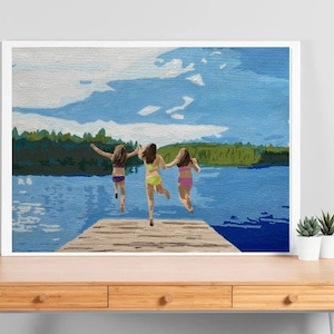 May include: Three people jump off a wooden dock into a lake. The lake is blue and the sky is light blue with white clouds. The people are wearing swimsuits and are jumping with their arms outstretched.