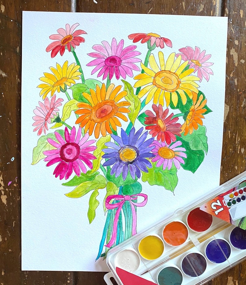 May include: A watercolor painting of a bouquet of colorful flowers, including pink, yellow, orange, red, and purple flowers. The flowers are tied together with a pink ribbon and are arranged in a vase. A watercolor paint set is visible in the bottom right corner of the image.