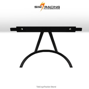 May include: Black metal Tobii eyeTracker stand. The stand has a horizontal top with two holes and a central support structure. The base is a curved arc. The text "SIM RACING ACCESSORIES" is at the top. The text "Tobii eyeTracker Stand" is at the bottom.