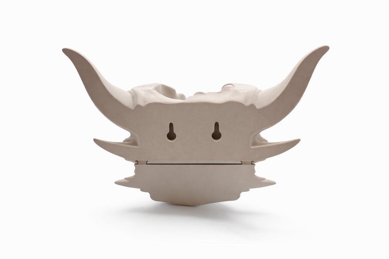 Rear view of the dragon skull wall planter showing mounting holes and flat back surface.