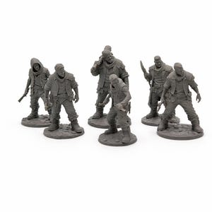 May include: A collection of gray miniature figurines depicting post-apocalyptic characters. The figures are detailed with various weapons and attire, suggesting a survival or combat theme. Each figure stands on a small, round base.