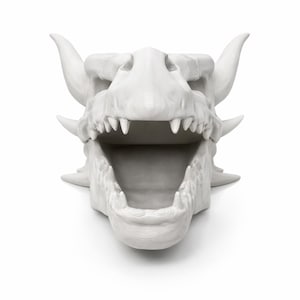 Front view of the dragon skull head planter with mouth fully open, showing teeth and interior cavity.