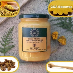 May include: A jar of natural pure honey from wildflowers and herbs. The label includes the text "Sweet Therapy". The image also shows beeswax, pollen, and a honey dipper.