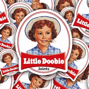 May include: A collection of stickers featuring a vintage-style illustration of a young girl with red hair, wearing a blue plaid shirt and a straw hat. The stickers have the text "Little Doobie Joints" in a red banner.