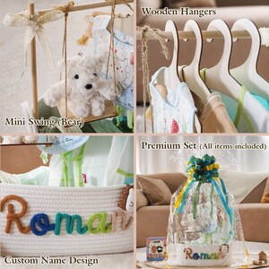 May include: A baby gift set featuring a mini swing with a teddy bear, wooden hangers, and a custom name design on a woven basket. The set includes baby clothes and accessories, all wrapped in cellophane with a decorative bow.