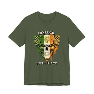 May include: An olive green t-shirt with a skull design incorporating the Irish flag. The skull is surrounded by Celtic knotwork, and the text reads "NO LUCK. JUST LEGACY."