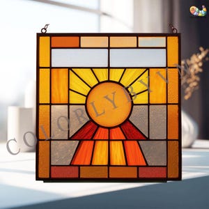 May include: A square stained glass panel with a sun design. The sun has a yellow circle and radiating yellow rays, set against orange, red, and grey glass. The panel is framed in dark brown metal. The design is reminiscent of a sunrise.