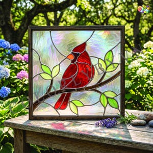 May include: Stained glass panel depicting a red cardinal on a branch with green leaves. The bird has an orange beak and is set against an iridescent background. The panel is framed in a dark brown wood.