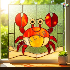 May include: Stained glass panel featuring a cartoon crab design. The crab is primarily red and orange with yellow accents, set against a textured green background. The crab is positioned on a sandy base, with a small succulent plant in a white pot visible.