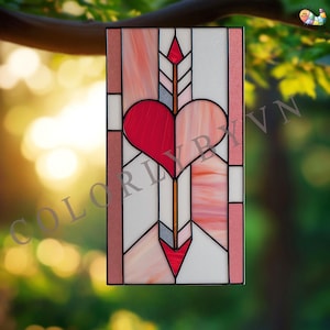 May include: Stained glass panel featuring a red heart pierced by an arrow. The panel has a rectangular shape with a geometric design in shades of red, pink, and white. The text "COLORLYBYVN" is visible at the bottom.
