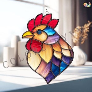 May include: A stained glass rooster head with a vibrant color palette. The rooster features a red comb, yellow beak, and blue eye. The design incorporates shades of red, orange, yellow, blue, and purple, with a black outline. It is designed to hang.