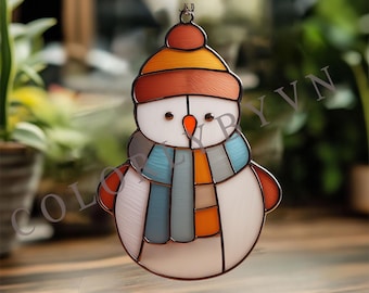 May include: A stained glass snowman ornament with a brown metal frame. The snowman has a carrot nose, black eyes, and a colorful scarf. The hat is orange and brown. The ornament is hanging from a metal loop.