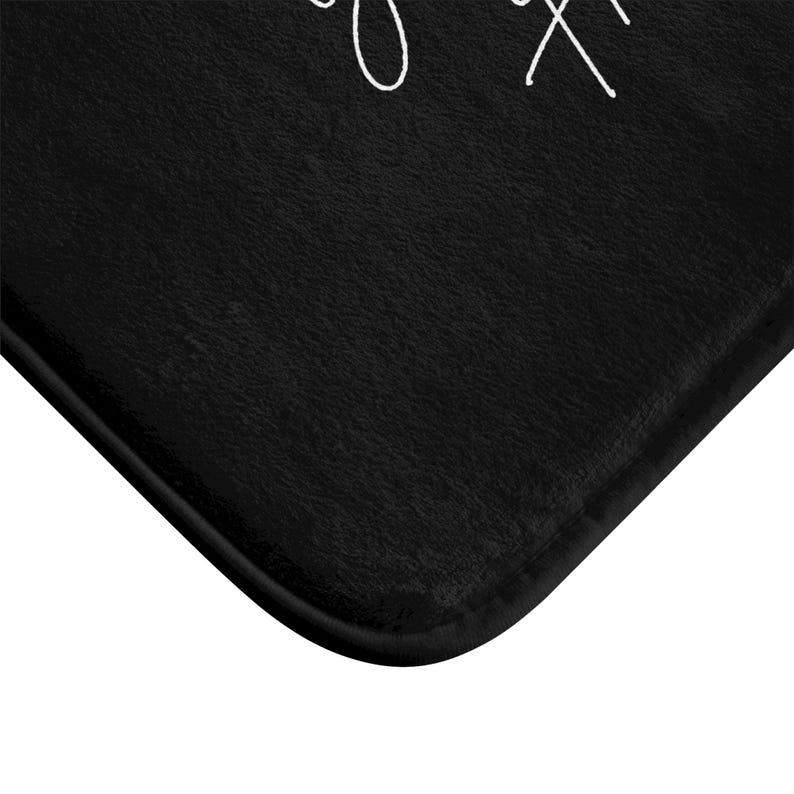 a black mat with white writing on it