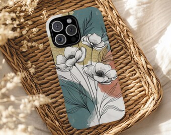 Könnte beinhalten: Eine Handyhülle mit floralem Design, mit weißen Blumen und schwarzer Linienzeichnung. Die Hülle hat einen Hintergrund in Türkis, Gold und Koralle. Die Handyhülle liegt auf einem geflochtenen Tablett.