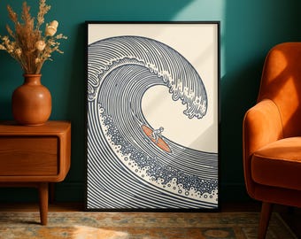 Puede incluir: Una impresión artística enmarcada que presenta una ilustración estilizada de una gran ola oceánica con un surfista. La ola está representada en líneas azul marino y blanco, con el surfista y la tabla de surf en naranja. La obra está en un marco negro.