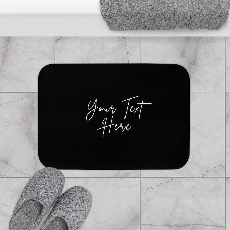 a pair of slippers sitting on top of a bathroom floor