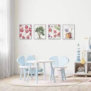 May include: Four framed art prints depicting pomegranates, an olive tree, figs, and a honey pot with lavender. A small white table and three light blue chairs are in front of the wall art. The chairs have a butterfly-like design.