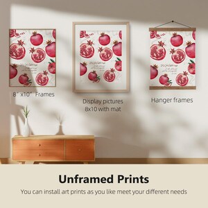 May include: Three framed art prints featuring watercolor pomegranates with Arabic script. The prints are displayed in 8" x 10" frames, with a mat, and as a hanging print. The text "Unframed Prints" is at the bottom.