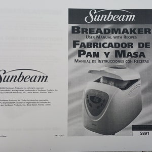 May include: A black and white image of a Sunbeam breadmaker user manual with recipes. The manual is titled "Breadmaker" and "Fabricador de Pan y Masa". The manual includes instructions and recipes for making bread and dough.