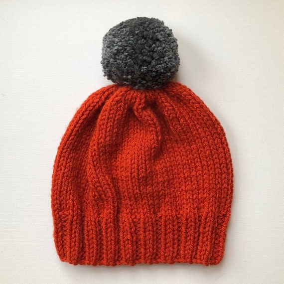 Bobble Hat in Burnt Orange Chunky Yarn With Grey Pom Pom 