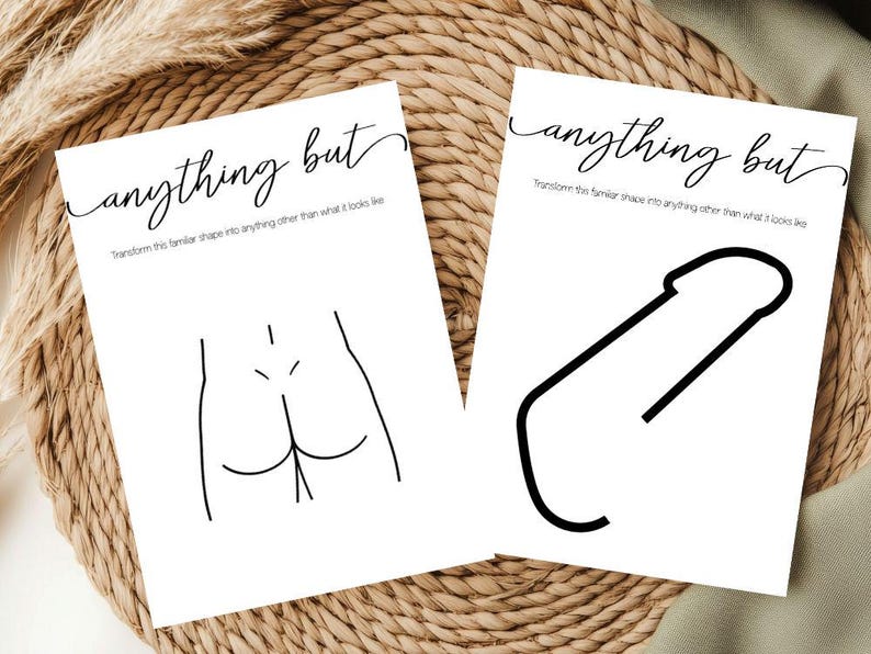 May include: Two white art prints with black line drawings and text. One print depicts a stylized rear view of a person, the other a phallic shape. The text reads "anything but" and "Transform this familiar shape into anything other than what it looks like."