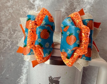 Orange glitter peaches tumbler bow