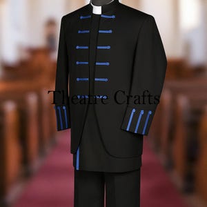 May include: A black suit with a mandarin collar and blue trim. The suit has a row of blue buttons down the front and blue accents on the cuffs. The text "Theatre Crafts" is visible on the front of the suit.