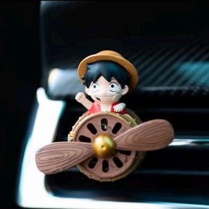 One piece figurine rotating car air freshener