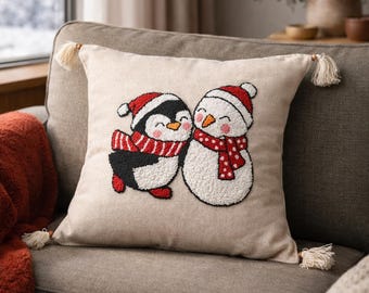 Gezellige kussensloop met punchnaald: pinguïn en sneeuwpop