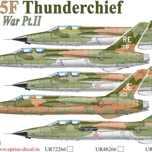 May include: An illustration of several F-105F Thunderchief fighter jets from the Vietnam War. The aircraft are painted in camouflage patterns of green, brown, and tan. Each jet has unique markings, including tail numbers and squadron identifiers.