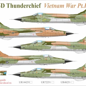 May include: An illustration of F-105D Thunderchief fighter jets from the Vietnam War. The image shows multiple views of the aircraft with camouflage patterns in green, brown, and tan. Text includes "F-105D Thunderchief Vietnam War Pt.I".