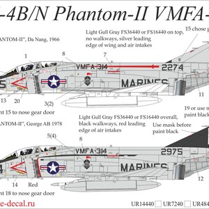 May include: Diagram of two F-4B/N Phantom-II VMFA-314 aircraft. The top aircraft is light gray with red accents and the text "MARINES". The bottom aircraft is also light gray with black accents and the text "MARINES". The image includes text and numbers.