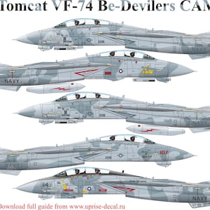 May include: A side view illustration of five F-14B Tomcat fighter jets in a camouflage paint scheme. The jets are labelled with the text "VF-74 Be-Devilers CAMO". The text "UR144263", "UR72263", "UR48263", and "UR32263" are listed below the jets.
