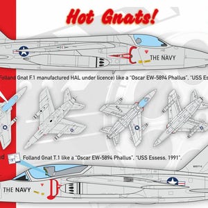Op de afbeelding: Een modelbouwset voor een Folland Gnat T.1 straaljager, een Brits ontworpen vliegtuig. De set is in schaal 1:72 en bevat decals voor de "USS Essess, 1991" livery. De afbeelding toont de dooskunst van de set, die een gedetailleerde illustratie van de Gnat T.1 in vlucht toont. De tekst "Hot Grats!" en "CtA cut then add" is ook zichtbaar op de dooskunst.