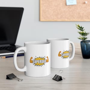 SuperDadマグカップ コミックブックスタイルのマッスルデザイン 11オンス セラミックコーヒーカップ 強くて素晴らしいお父さんへの父の日ギフト