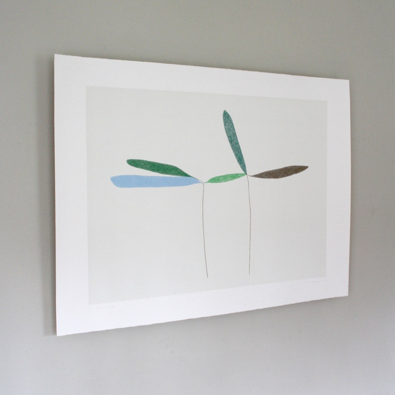 May include: A minimalist abstract art print featuring a stylized plant with green, blue, and brown leaves on a white background.