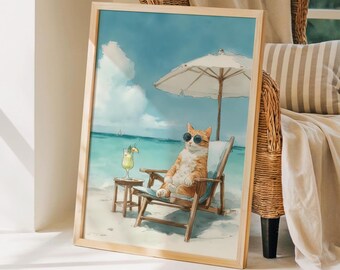 May include: A framed rectangular wall art print featuring an orange cat wearing black sunglasses, sitting in a wooden beach chair under a white umbrella on a sandy beach with a tropical drink on a small side table against a blue ocean background.
