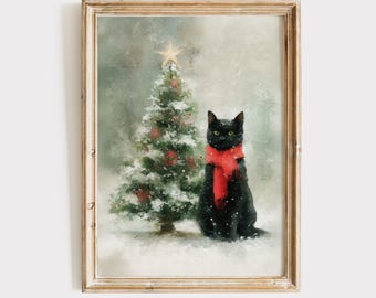 May include: A framed wall art print featuring a black cat wearing a bright red scarf sitting next to a snow-covered Christmas tree topped with a gold star. The scene is set against a soft, muted background with falling white snowflakes.