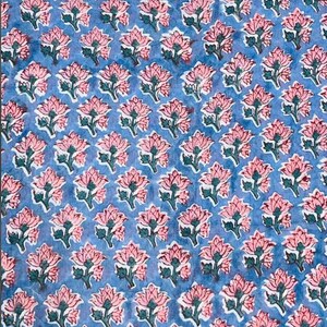 May include: A blue fabric with a repeating pattern of pink floral designs. Each flower has a detailed outline and green leaves. The overall effect is a delicate, yet bold, textile pattern.