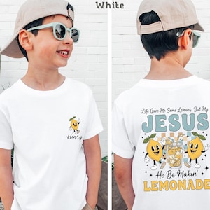Personalized Jesus Lemonade Shirt with happy lemon graphics and the quote “Life Gave Me Some Lemons, But My Jesus He Be Makin’ Lemonade” — cute faith based kids sweatshirt and Christian shirt.