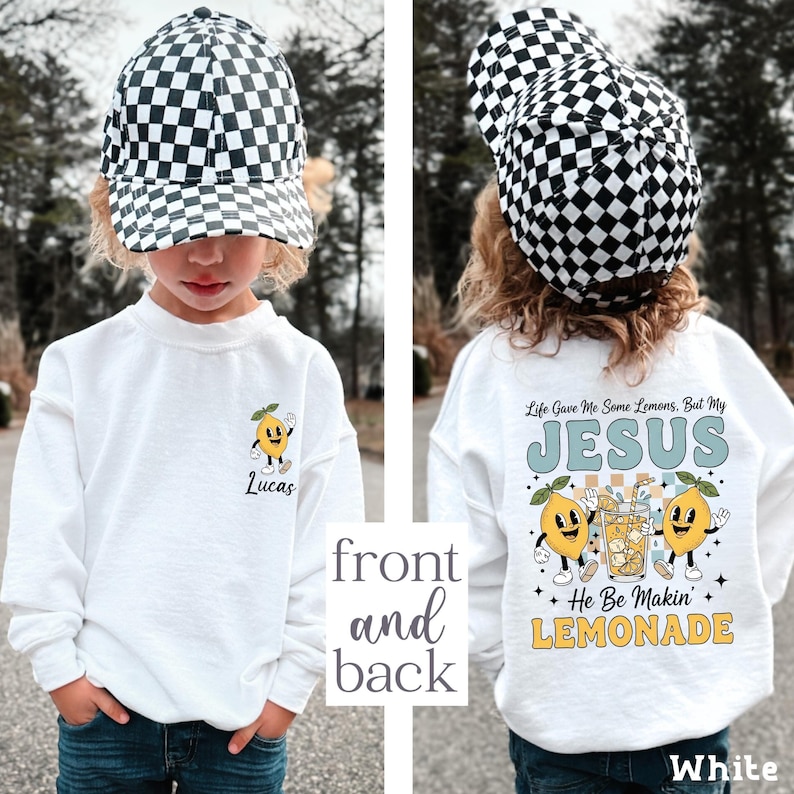 Personalized Jesus Lemonade Shirt with happy lemon graphics and the quote “Life Gave Me Some Lemons, But My Jesus He Be Makin’ Lemonade” — cute faith based kids sweatshirt and Christian shirt.