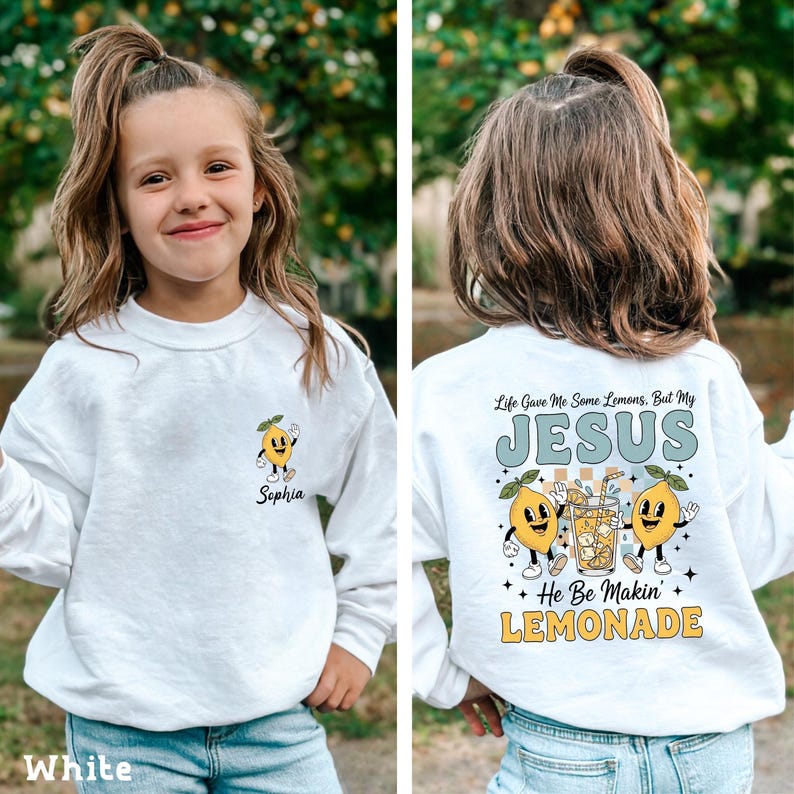 Personalized Jesus Lemonade Shirt with happy lemon graphics and the quote “Life Gave Me Some Lemons, But My Jesus He Be Makin’ Lemonade” — cute faith based kids sweatshirt and Christian shirt.