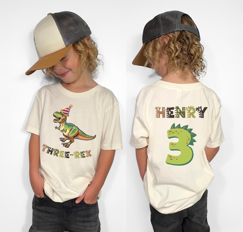 Dinosaur-themed family birthday shirts including a Three Rex or Four Rex kids tee with name and age on back, plus matching Mama Saurus, Dada Saurus, and sibling designs — ideal for dinosaur birthday parties.Dinosaur-themed family birthday shirts including a Three Rex or Four Rex kids tee with name and age on back, plus matching Mama Saurus, Dada Saurus, and sibling designs — ideal for dinosaur birthday parties.