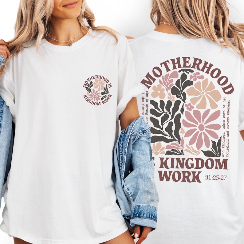 two women wearing white t-shirts with a floral design and text on the back.